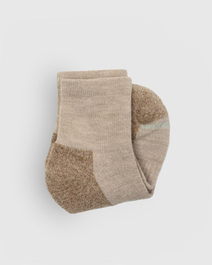 Classic Beige Marled Merino Wool - Marled Quarter Sock (Detail): Folded beige marled quarter sock showing ribbed cuff and tan sole