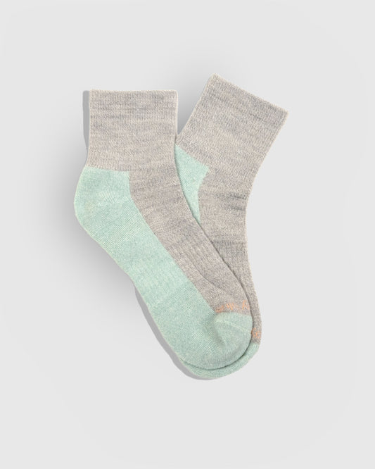 Stone Marled Merino Wool - Marled Quarter Sock (Flat-lay): Grey marled quarter socks with mint green heel, sole and toe