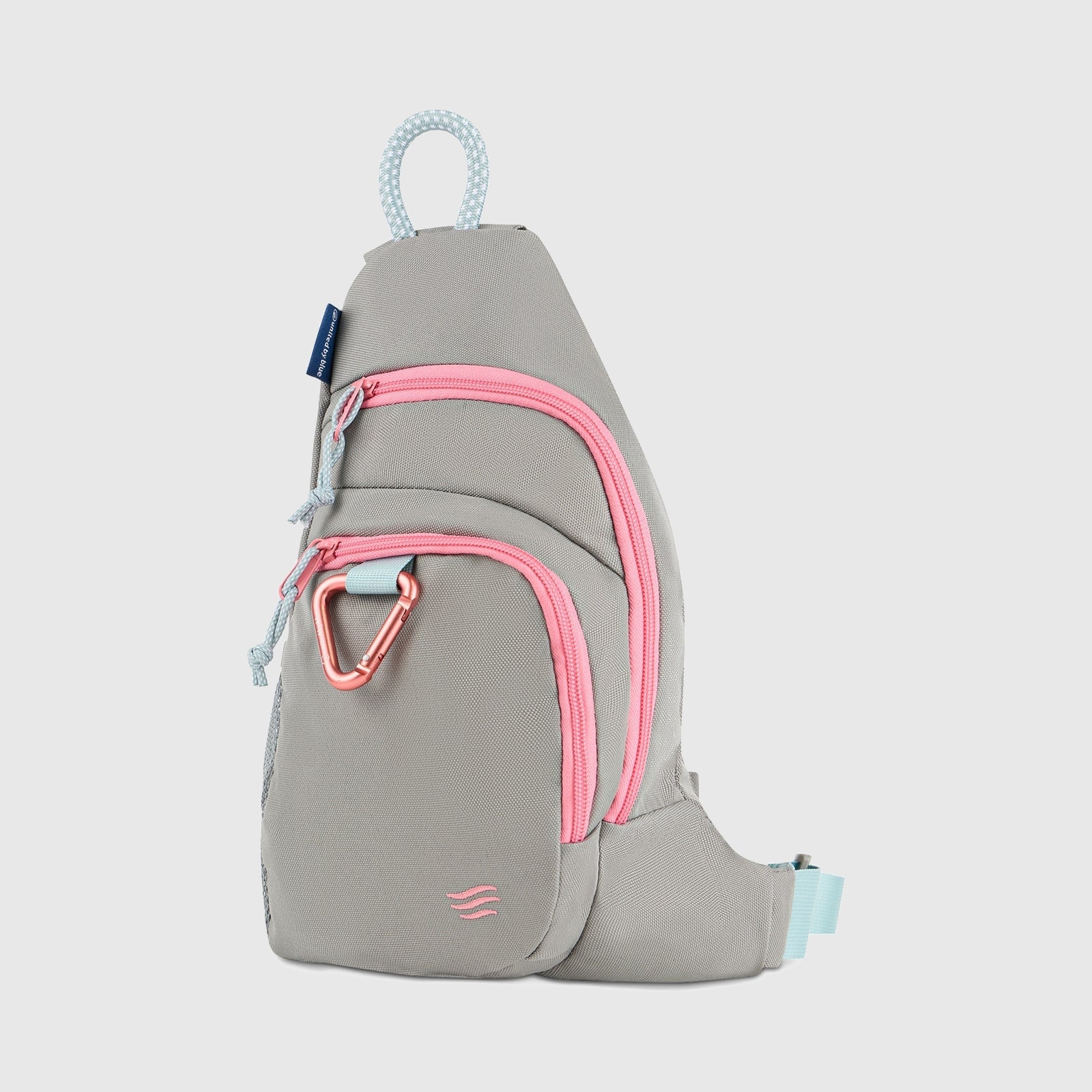 Lt Gray (R)evolution Sling Pack (Front): Light gray sling pack with bright pink zippers, pink carabiner clip, and blue rope handle