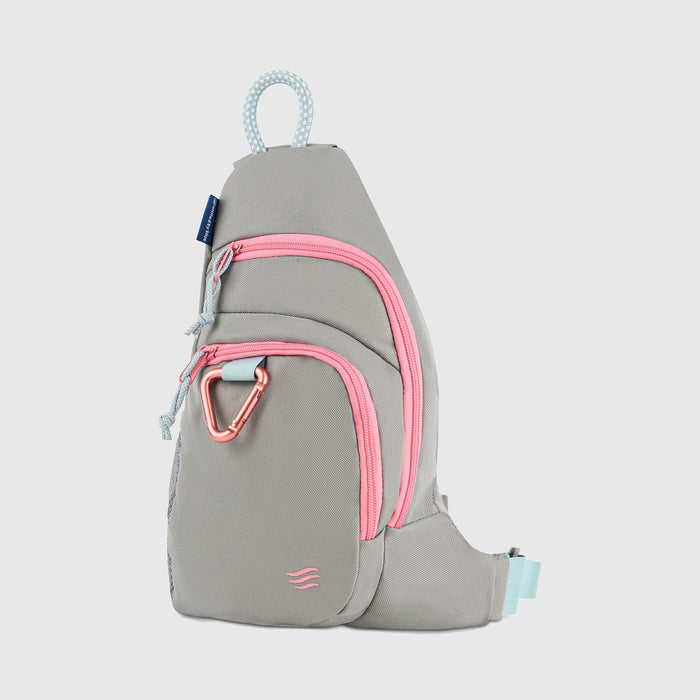 Lt Gray (R)evolution Sling Pack (Front): Light gray sling pack with bright pink zippers, pink carabiner clip, and blue rope handle
