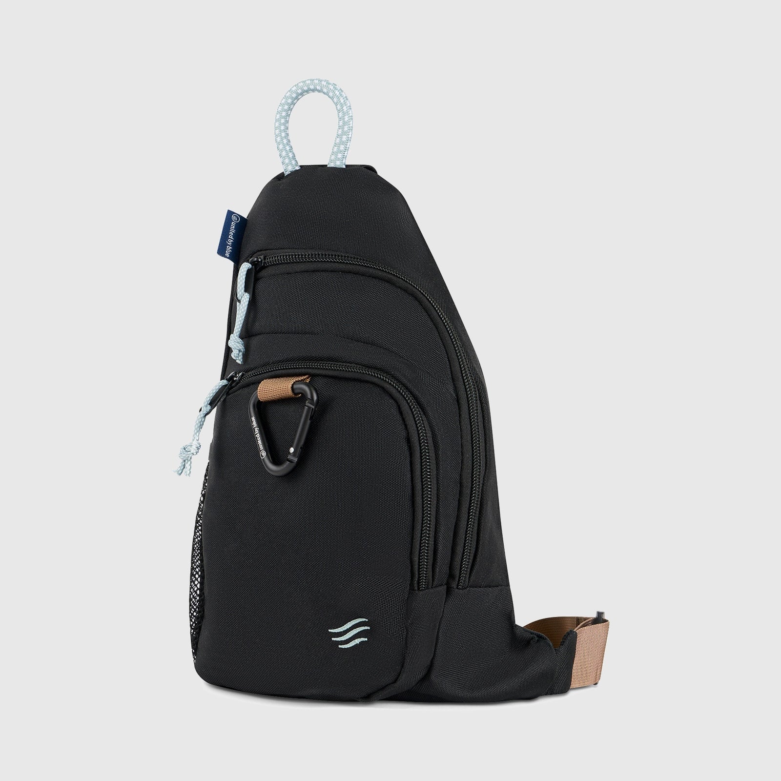 Black (R)evolution Sling Pack (Front): Black sling pack with two zip pockets, black carabiner, light rope handle, tan strap