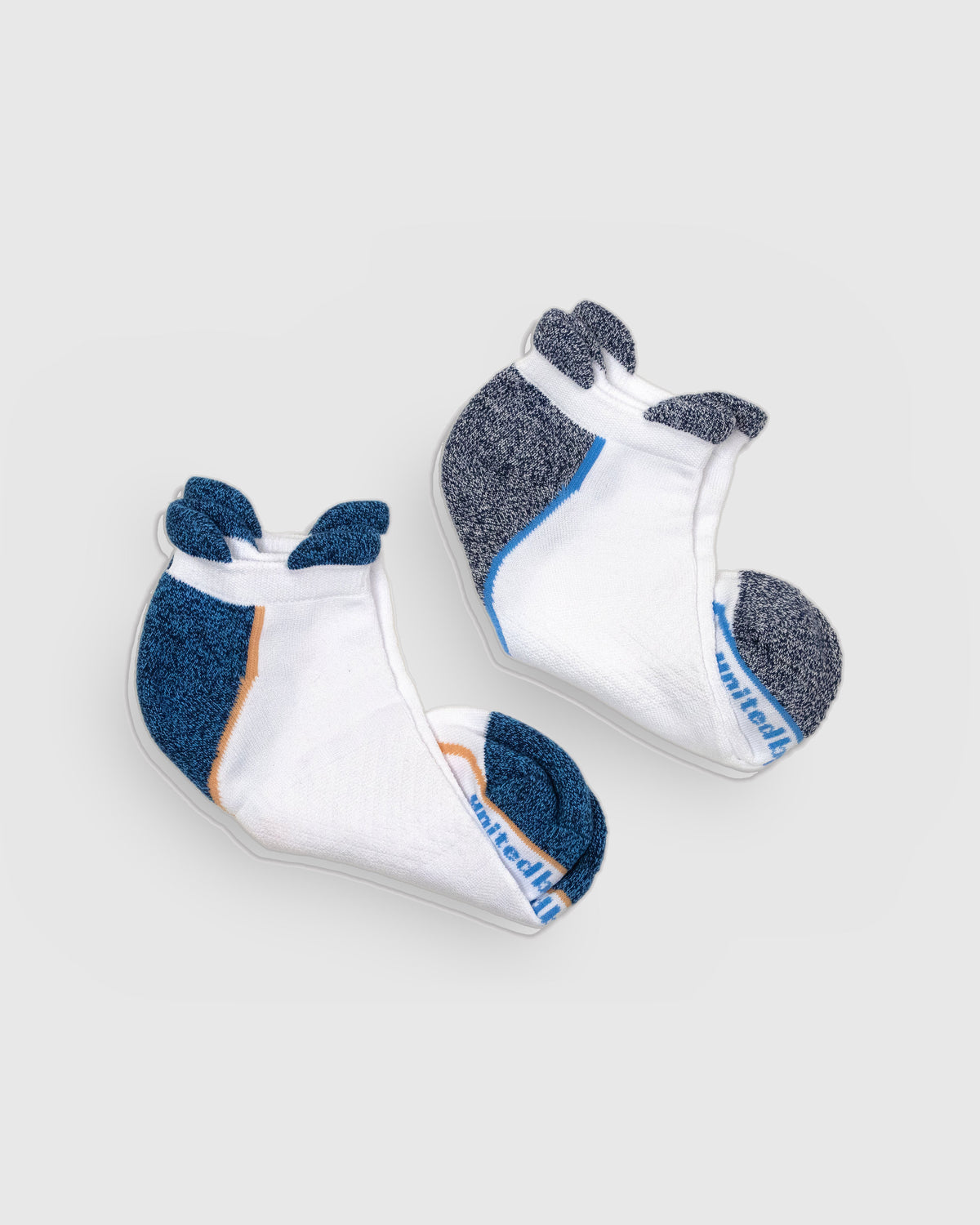 White Rayon From Bamboo - Athletic Low Cut Sock - 2 Pack (Detail): Folded white bamboo low-cut socks showing navy heel and orange trim
