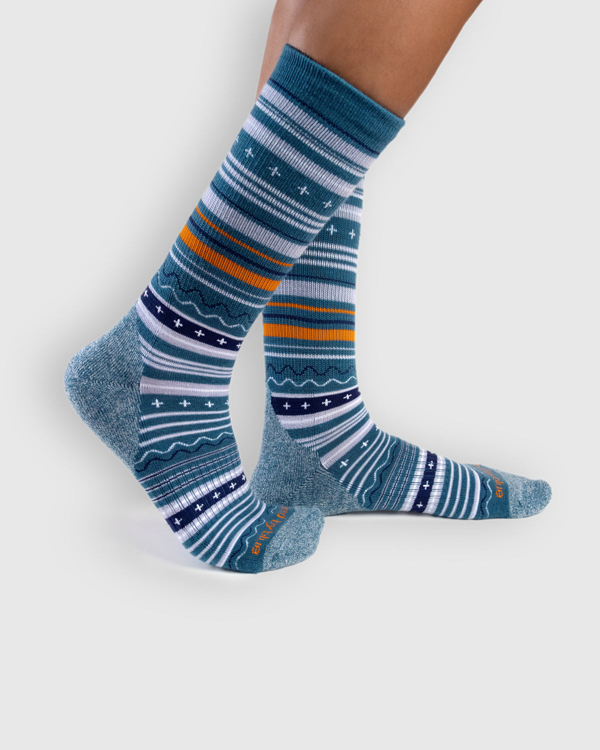 Teal Merino Wool Trail Crew Sock - New Color (In-use): Teal striped merino crew socks worn on feet, side view