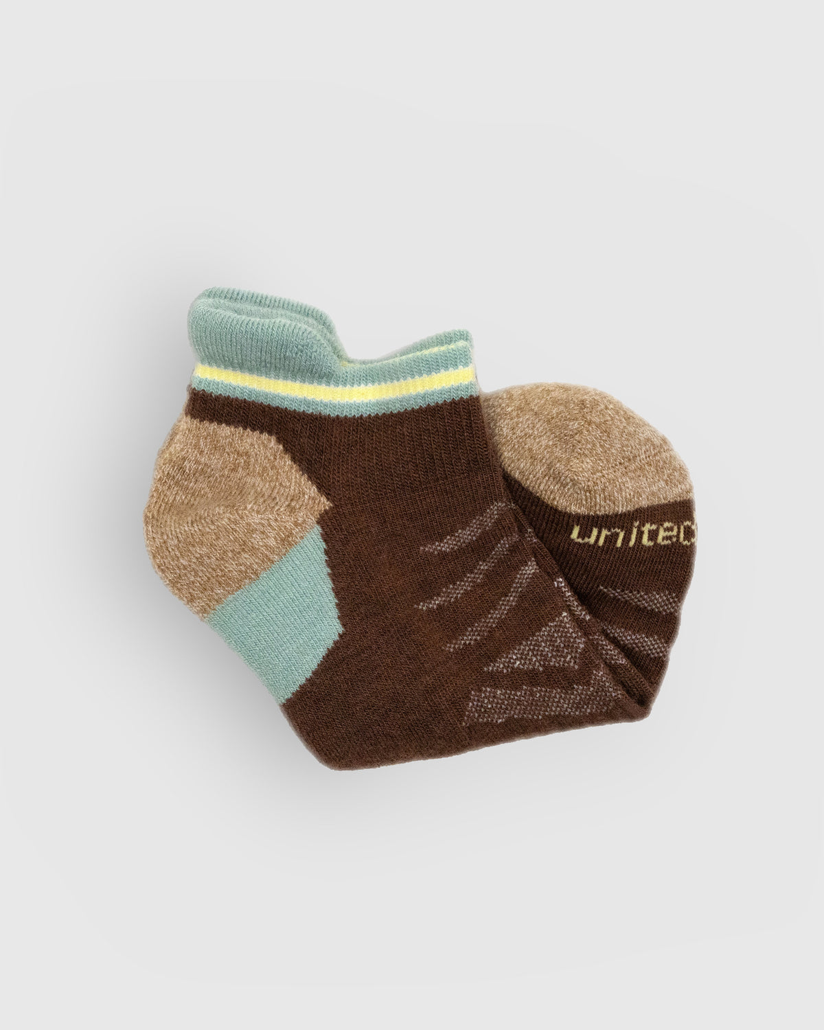Cocoa Merino Wool - Low Cut Sock (Detail): Folded brown low-cut sock showing mint cuff and tan marled toe