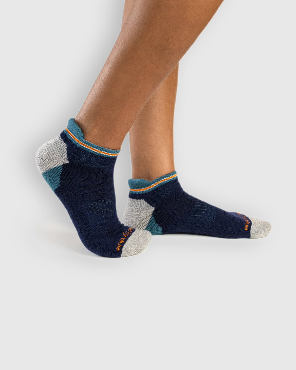 Midnight Merino Wool - Low Cut Sock (In-use): Navy and teal merino low-cut socks worn on feet, side view