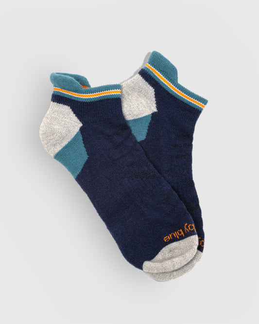 Midnight Merino Wool - Low Cut Sock (Flat-lay): Navy low-cut socks with teal cuff, orange stripe, grey heel and toe