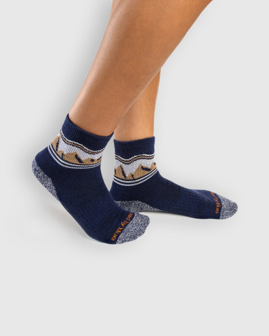 Navy Mountainscape Merino Wool - Quarter Sock - New Color (In-use): Navy mountain-pattern merino quarter socks worn on feet, side view