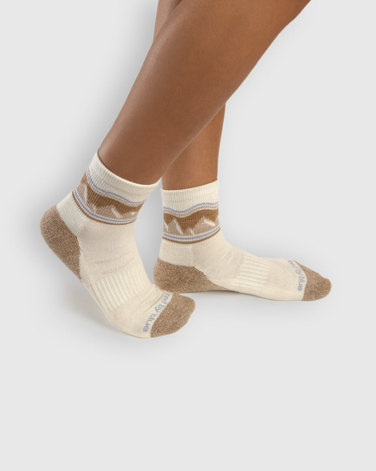 Off White Merino Wool - Quarter Sock - New Color (In-use): Cream bison-pattern merino quarter socks worn on feet, side view