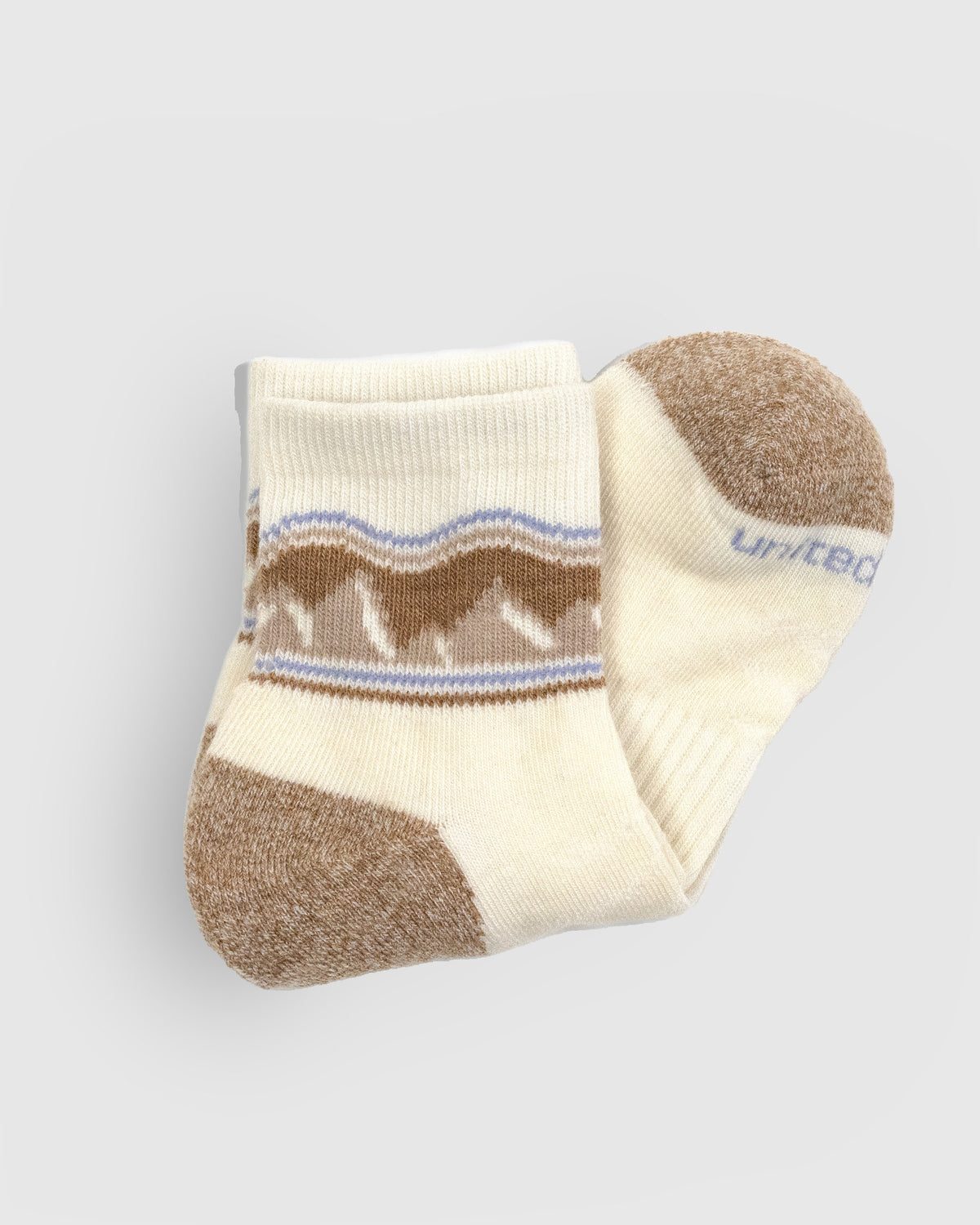 Off White Merino Wool - Quarter Sock - New Color (Detail): Folded cream quarter sock showing bison pattern cuff and tan toe