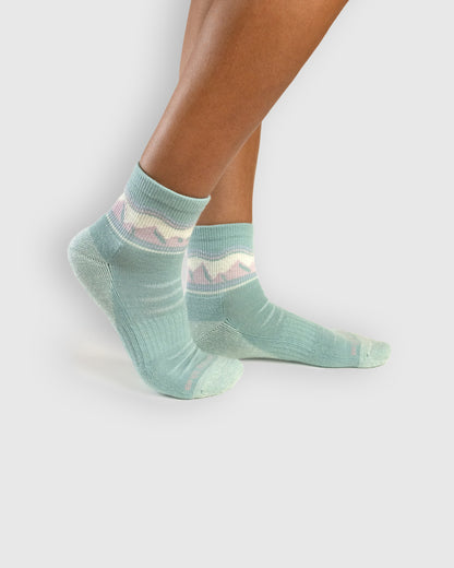 Sage Merino Wool - Quarter Sock - New Color (In-use): Sage green mountain-pattern merino quarter socks worn on feet, side view