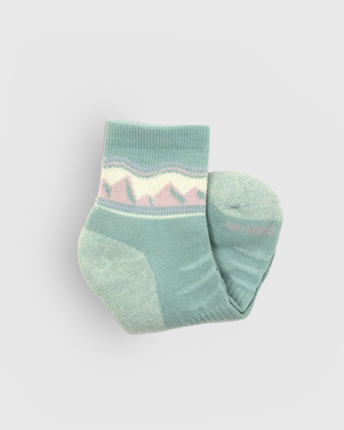 Sage Merino Wool - Quarter Sock - New Color (Detail): Folded sage quarter sock showing mountain pattern cuff and pale sole