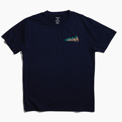 XS Moonlit Reflection Graphic Crew (Flat-lay): Navy blue crew neck tee with small forest trees graphic on chest