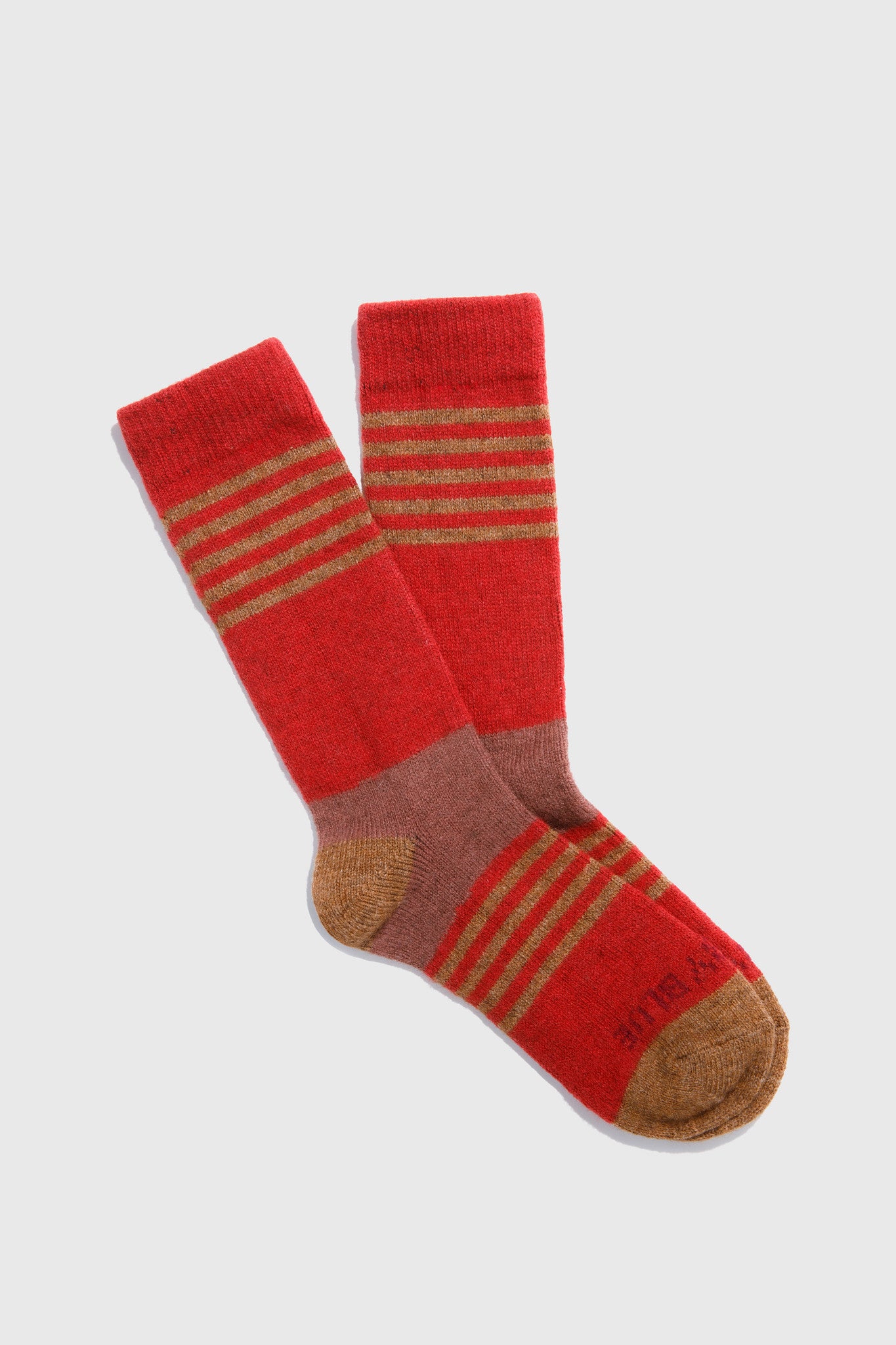 Red socks with brown accents on a light gray background