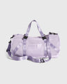 Lavender (Re)active™ 16L Mini Duffle (Angle): Light purple mesh duffle with satin straps, black buckles, and logo patch