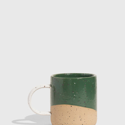 Pine 8 oz. Stoneware Mug (Angle): Deep green glazed upper half, unglazed speckled tan lower half, white handle