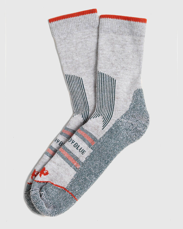 Green Bison Wool Trail Sock (Flat-lay): Pair of light grey crew socks with red cuff, teal heel and toe