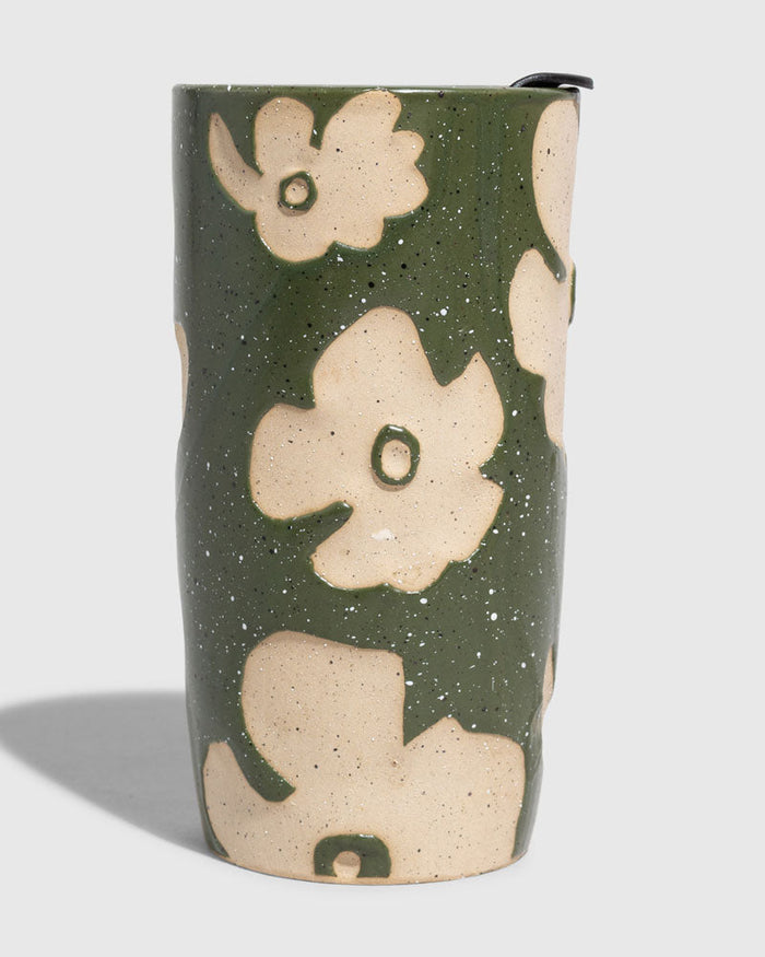Forest Floor 10 oz. Insulated Stoneware Travel Mug (Angle): Cylindrical ceramic mug, olive green glaze with raised cream floral motifs, black lid