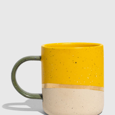 Butterscotch 8 oz. Stoneware Mug (Angle): Yellow speckled upper half, unglazed natural lower half, olive green handle