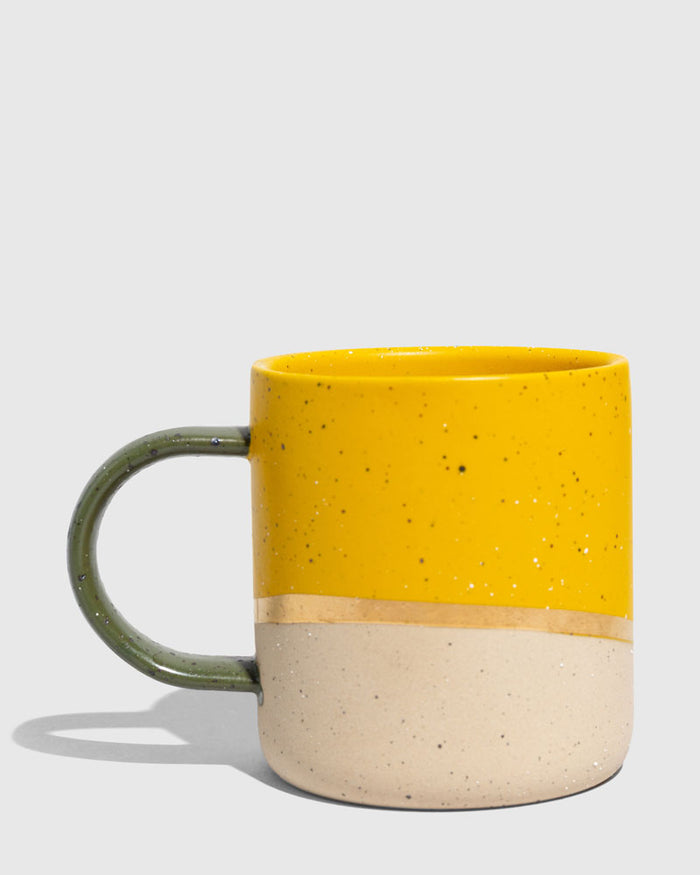 Butterscotch 8 oz. Stoneware Mug (Angle): Yellow speckled upper half, bare clay lower half, olive green handle