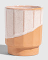 Foxglove 8 oz. Stackable Stoneware Tumbler (Angle): Ribbed stoneware cup with speckled pink glaze over natural terracotta base