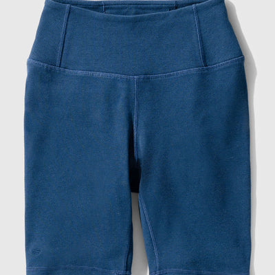 Midnight EcoKnit™ Ribbed Bike Short (Flat-lay): Dark blue ribbed bike shorts with wide waistband and seamed legs