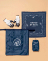 Navy Reusable DIY Cleanup Kit (Flat-lay): Navy bandana, gloves, tote bag, and small pouch on beige background